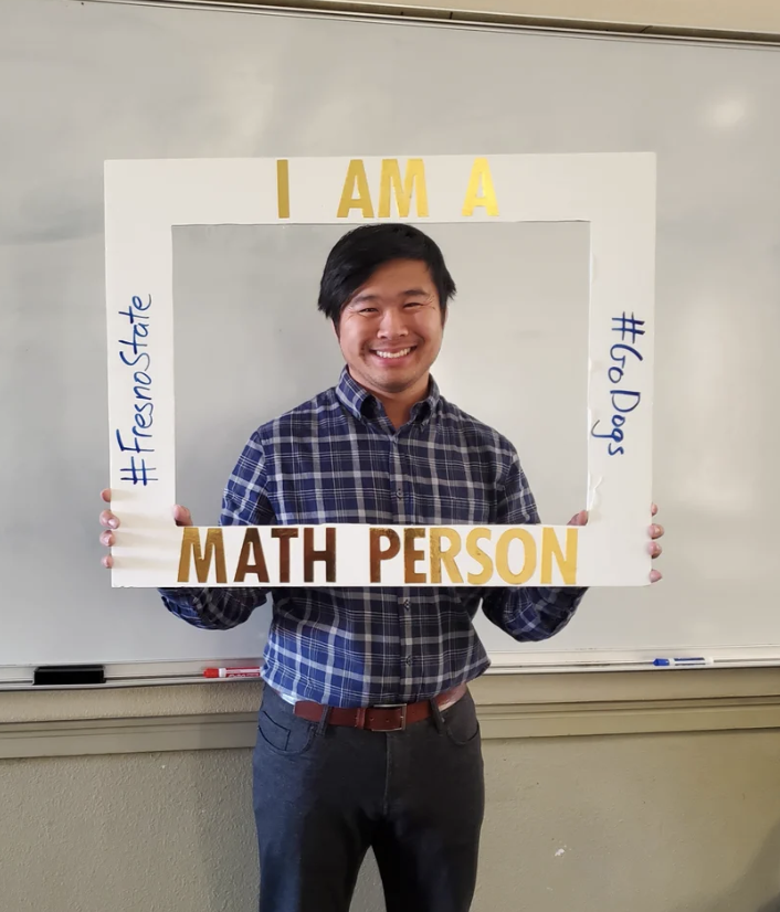 A picture of me with a frame that says "I am a math person"